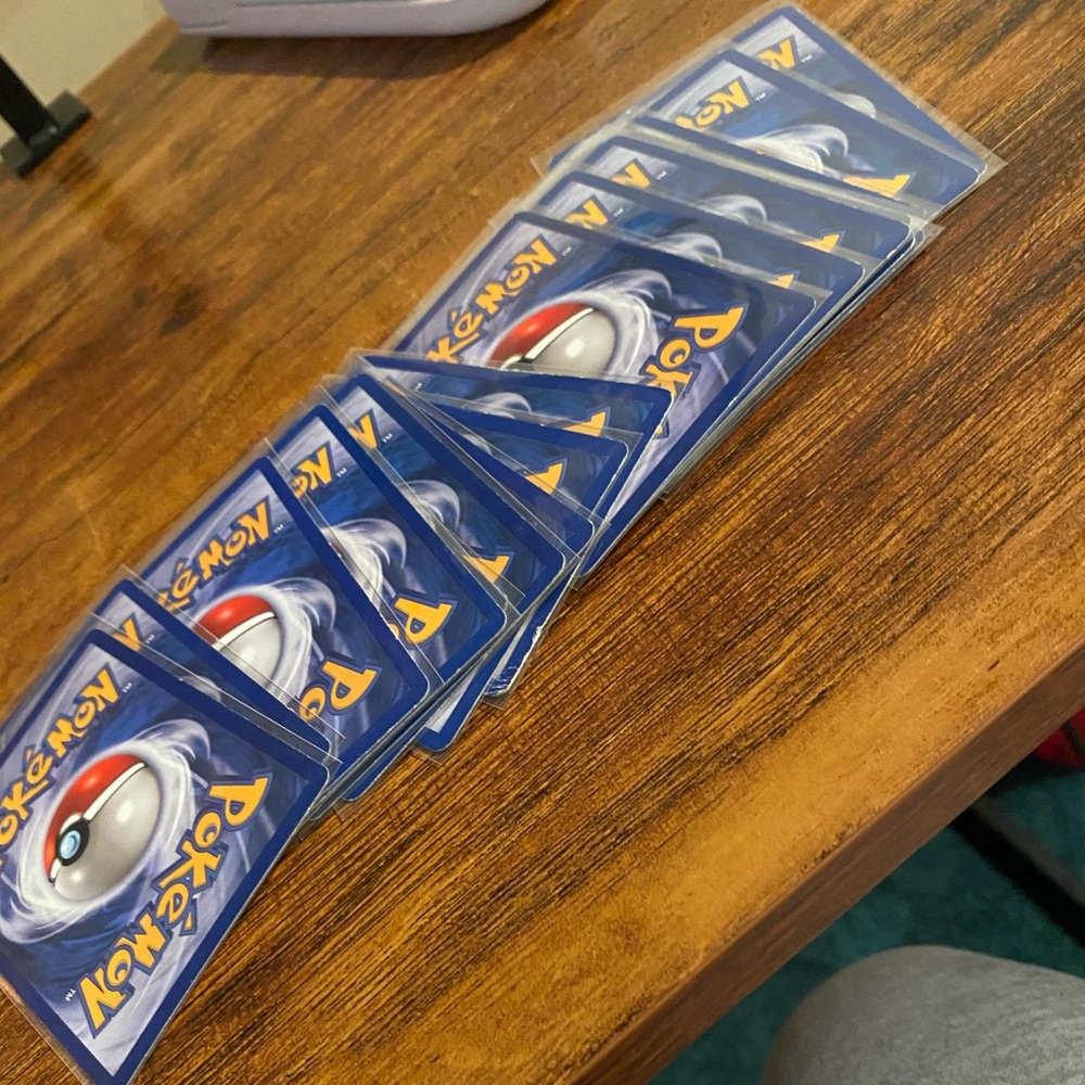 20sleeved Pokémon cards, varying sets and rarities